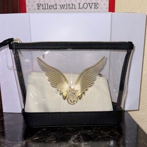 VS Clear and Black Cosmetic Bag with a small CLINIQUE pouch inside